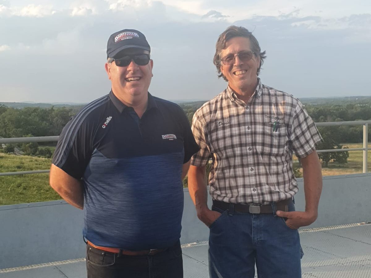 Two representatives of Dairy Power at the North American Manure Expo with Troop Equipment